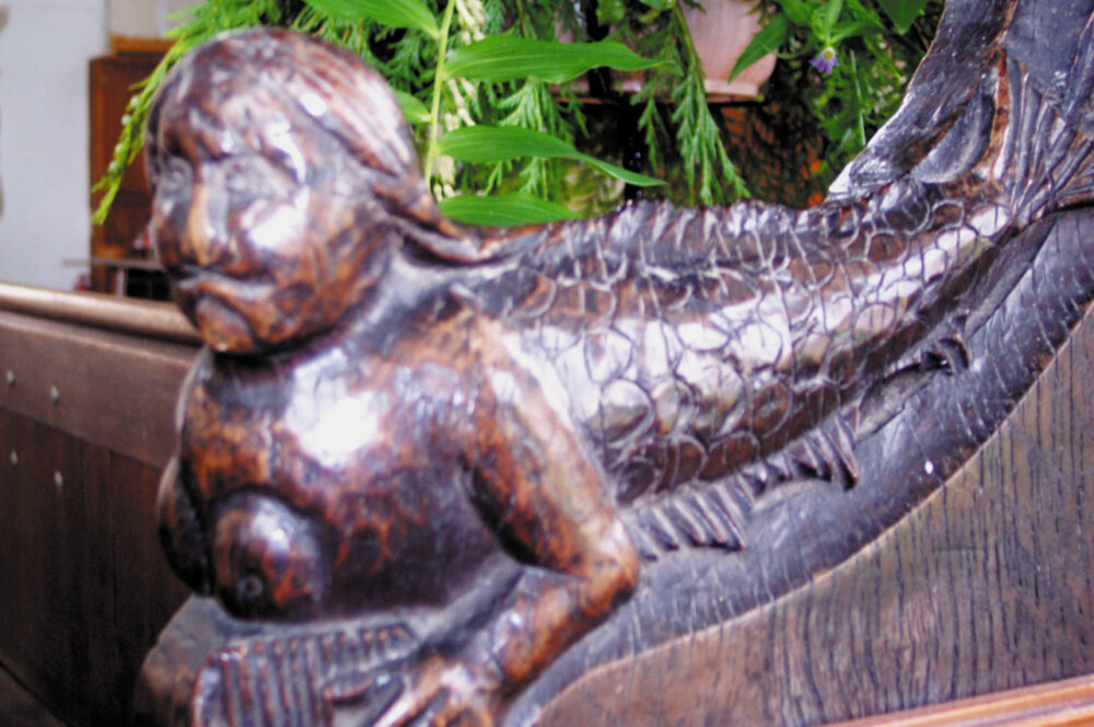 The mermaid sculpture in Little Sheringham church